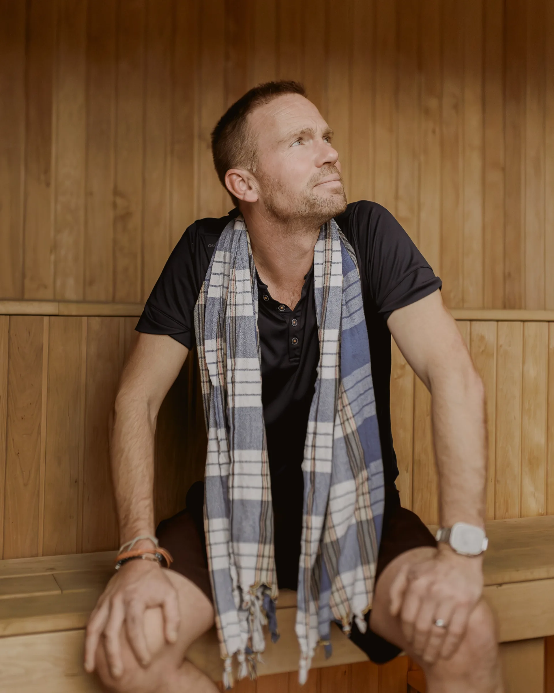 Portrait of Johnny Palmer in a sauna setting.